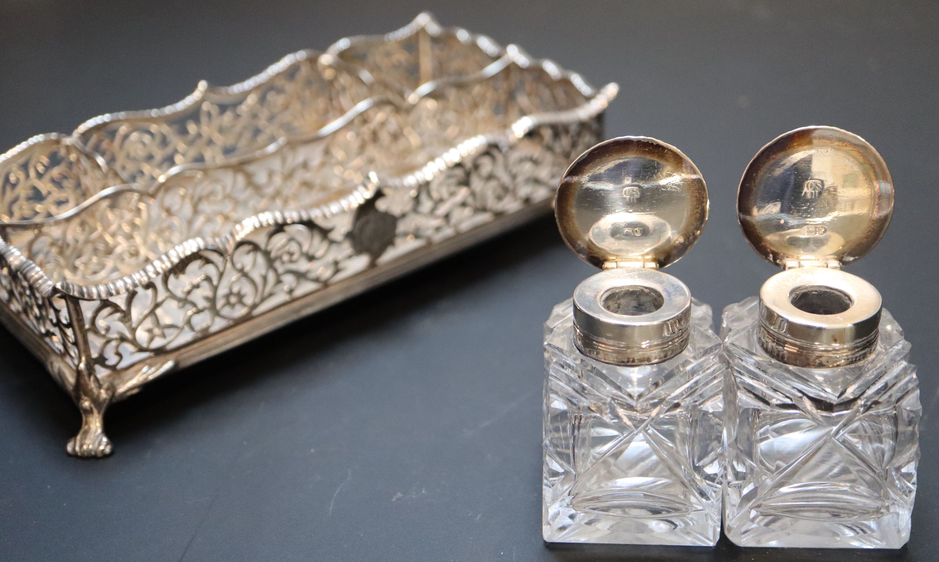 A Victorian silver rectangular inkstand with pierced gallery and two glass wells, Charles Stuart Harris, London, 1886/7, 18.7cm,